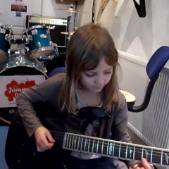 8 year old The Mini Band guitarist Zoe Thomson working on Stratosphere by Stratovarius